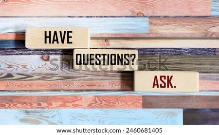 Ask questions, text words typography written on wooden blocks and vintage background, business marketing tips, motivational inspirational concept