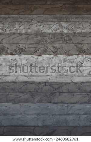 A close-up photo for background material on a concrete wall designed to look like a cross section of a stratum