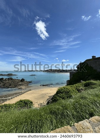 Blueish sea in Saint-Lunaire, France Royalty-Free Stock Photo #2460693793