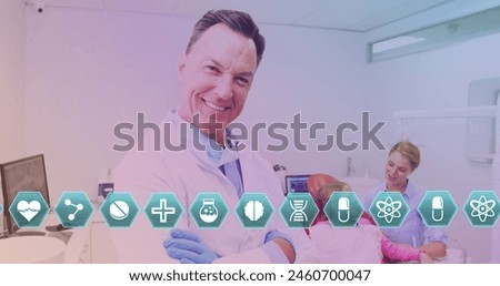 Image of diverse icons over happy senior caucaisan lab worker looking at camera. science, medicine and technology concept digitally generated image.