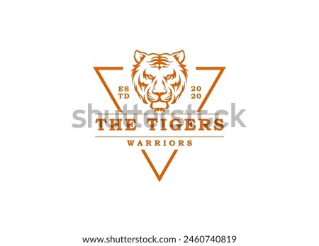 A bengal tiger face head with fangs and kung fu chinese lettering for Kungfu Club Martial Clan logo design Royalty-Free Stock Photo #2460740819