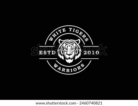 A bengal tiger face head with fangs and kung fu chinese lettering for Kungfu Club Martial Clan logo design Royalty-Free Stock Photo #2460740821