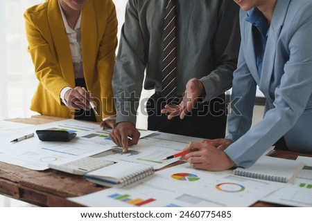 Meeting to present the financial business management team Discuss meetings to plan events Real Estate Investment Project Analysis strategy and discuss financial graphs and budgets in the office.