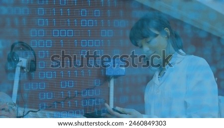 Image of data processing over biracial female doctor with patient. Global medicine and digital interface concept digitally generated image.