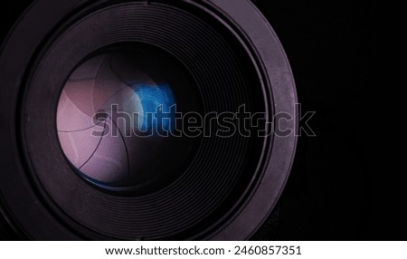 Close-up optical close-up black DSLR camera with closed iris diaphragm blades cine lens