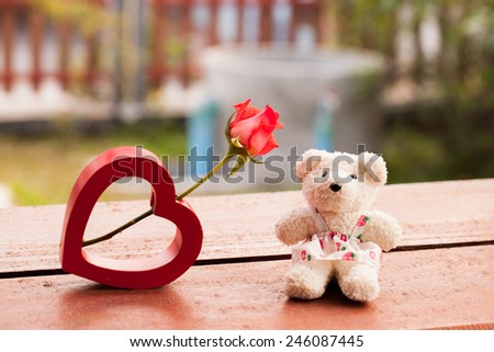Red heart and teddy bear for love in valentine, vintage style Valentines Day background.