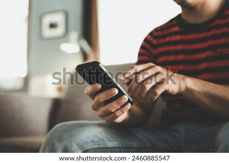 man using cell phone holding mobile texting message contact us.chatting,search internet shopping online.technology device communication connecting
