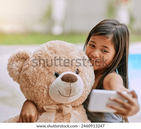 Happy, outdoor and girl with teddy bear, selfie and comfortable with happiness at home garden. Toddler, child development and love with fluffy toy gift outside for hugging, cozy picture and comfort