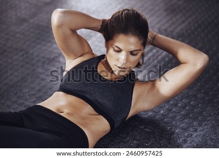 Fitness, sit ups and woman in gym for obliques workout, endurance challenge or core strength. Training, above and athlete person on floor for physical activity, muscle growth or abdomen exercise Royalty-Free Stock Photo #2460957425