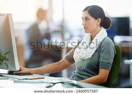 Business woman, computer and search online for ideas, planning and project startup in workspace. Young graphic designer, worker or employee reading proposal or brief for website on desktop in office