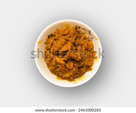 Loti Shutki bhuna is served in a white ceramic bowl on white background. Bengali traditional food dry fish curry. Top view.
 Royalty-Free Stock Photo #2461000283