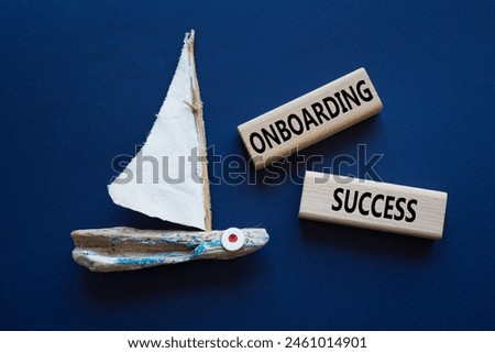 Onboarding Success symbol. Concept word Onboarding Success on wooden blocks. Beautiful deep blue background with boat. Business and Onboarding Success concept. Copy space