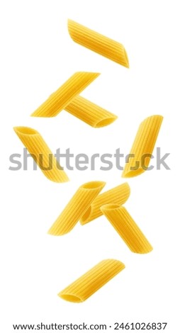 Falling raw Penne Rigate, uncooked Italian Pasta, isolated on white background, clipping path, full depth of field
