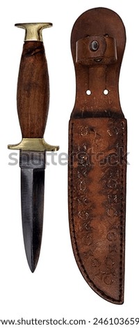 A Metal Dagger and leather scabbard Used for Defense Against an Enemy Royalty-Free Stock Photo #2461036599