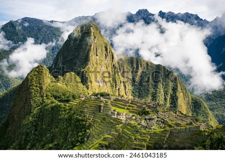 Explore Machu Picchu's grandeur in this captivating photo. Admire Inca terraces and stone temples surrounded by majestic mountains. An image that transports you to this iconic Peruvian Andes site.