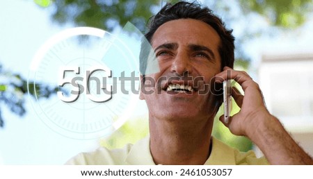 Image of 5g text over round scanner against caucasian man talking on smartphone at a park. Global networking and business technology concept