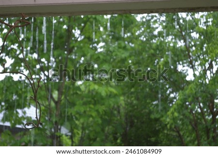 Background material for rainy days.
Water droplets dripping from the rain gutter.