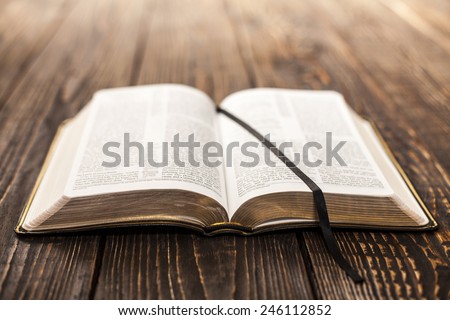 Open Book on wood background Royalty-Free Stock Photo #246112852