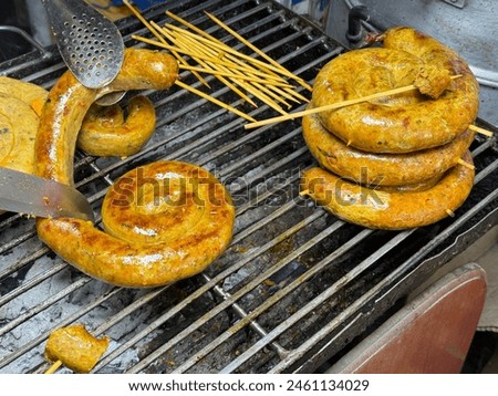 Northern Thai sausage or local call as Sai Aua, Grilled intestine stuffed with minced pork, spices and herbs popular local food in Thailand.