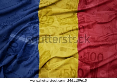 waving colorful national flag of romania on a euro money banknotes background. finance concept. macro shot
