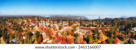 Blackheath regional town in the Blue Mountains of Australia - autumn colours glory pictured in aerial panorama.