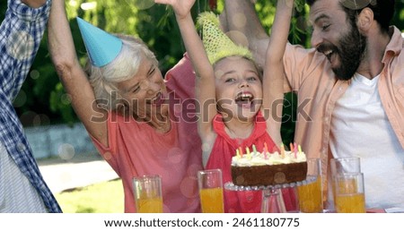 Image of bokeh over happy caucasian family in birthday hats celebrating together. family, relationship and spending quality time together concept digitally generated image.