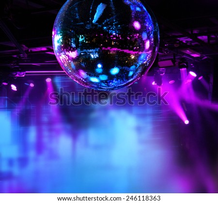 Colorful disco mirror ball lights night club background Royalty-Free Stock Photo #246118363
