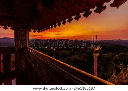 Blurred nature background of evening sky lights. There is a beautiful old pagoda of Wat Suwan Khiri in the Thai province of Ranong, high on a mountain overlooking Burma.