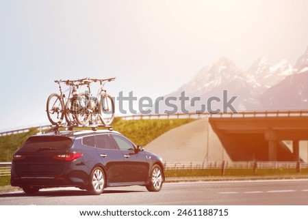 Passanger car with two bicycle mounted on the roof