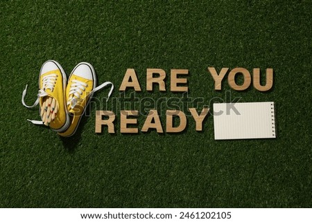 The inscription: "Are you ready?" on the grass.