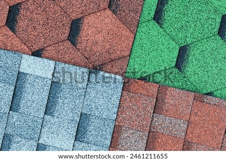It's the close up view of mosaic colorful tile. It is photo of green, blue and a brown roof tiles. It is view of multicolored texture of tiles.