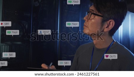 Image of notification bars, asian engineer checking data server system and writing in notepad. Digital composite, multiple exposure, social media, business, data center, networking, technology.