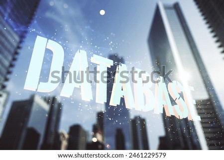 Double exposure of creative Database word hologram on modern skyscrapers background, research and development concept