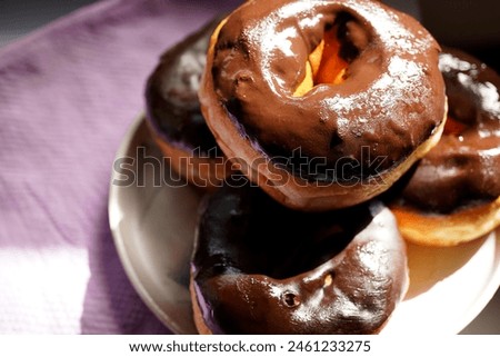 delicious and sweet chocolate donuts                               