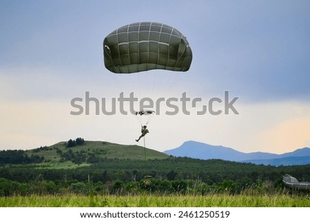 U.S. Army paratroopers, assigned to the 173rd Airborne Brigade, jump from a U.S. Air Force C-17 Globemaster III  Royalty-Free Stock Photo #2461250519