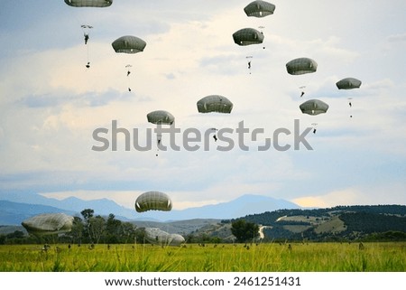 U.S. Army paratroopers, assigned to the 173rd Airborne Brigade, jump from a U.S. Air Force C-17 Globemaster III  Royalty-Free Stock Photo #2461251431