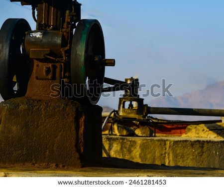 Water well, well, water pump, old water pumping motor, water wells.  Desert,  Royalty-Free Stock Photo #2461281453