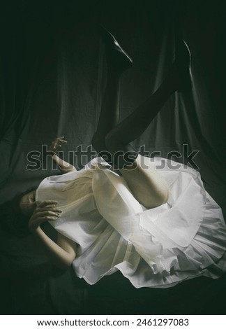dancer lying on the floor with her legs up in a desolate attitude, spain