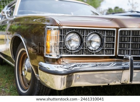 Close up of a vintage car headlights. Classic vehicle. Oldtimer car.