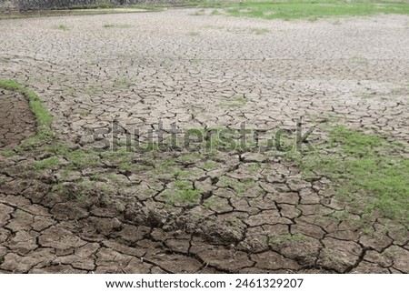 Global warming summer weather and cracked field stock photo.
