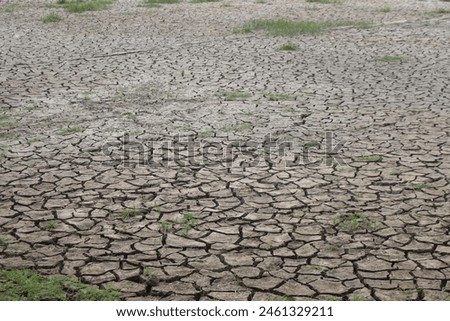 Global warming summer weather and cracked field stock photo.