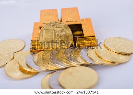  Cryptocurrency concept. Shining bitcoin cryptocurrency coin in front of five gold bars, isolated in white background. selective focus. 