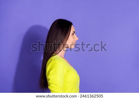 Profile side photo of adorable lovely girl wear stylish clothes look empty space isolated on purple color background