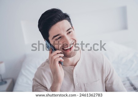 Photo of attractive cheerful man speaking phone on weekend morning cozy room white day light interior indoors Royalty-Free Stock Photo #2461362783