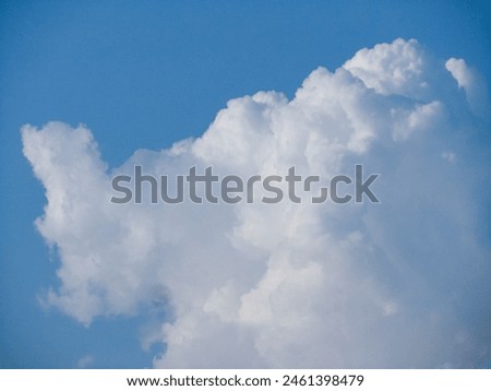 Photo of a large cloud on a blue sky background