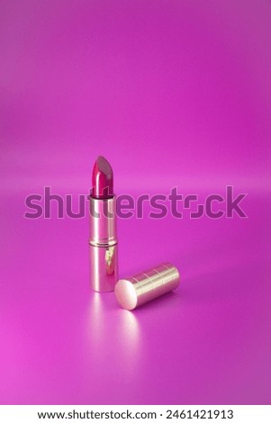 golden lipstick pack mock up on the pink background. Template of pack of lipstick Royalty-Free Stock Photo #2461421913