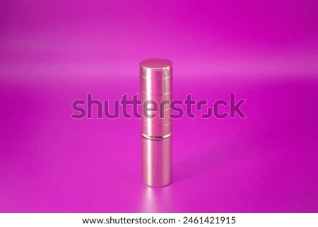 golden lipstick pack mock up on the pink background. Template of pack of lipstick Royalty-Free Stock Photo #2461421915
