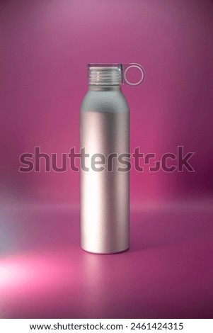 fitness bottle with a ring on the cap isolated on pink background. Mock up template Royalty-Free Stock Photo #2461424315