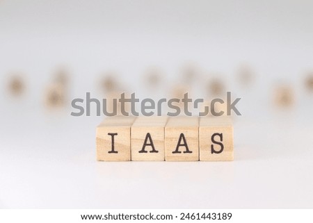 IAAS Acronym. Concept of Infrastructure as a Service written on wooden cubes isolated on white background