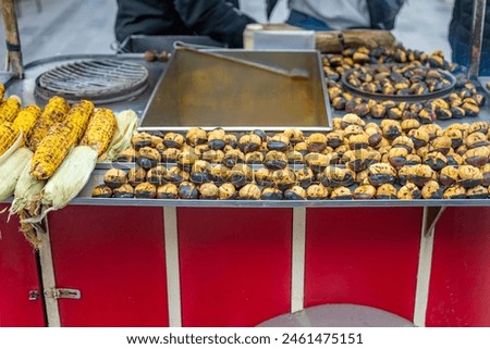 Fried chestnuts and grilled corn on the street of Istanbul, Turkey.